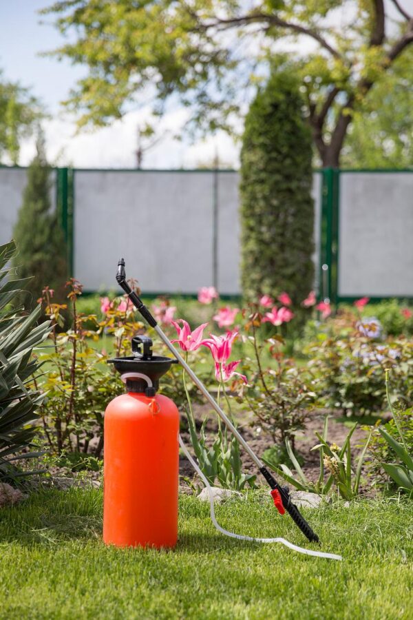 Pest control sprayer in yard